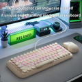 MOFII Candy M keyboard with lights featuring round pink and beige keys on a modern desktop setup