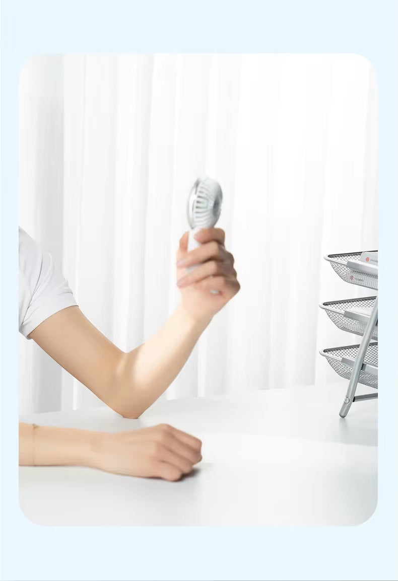 VMIDirect portable fan held in hand, perfect for on-the-go cooling and convenience