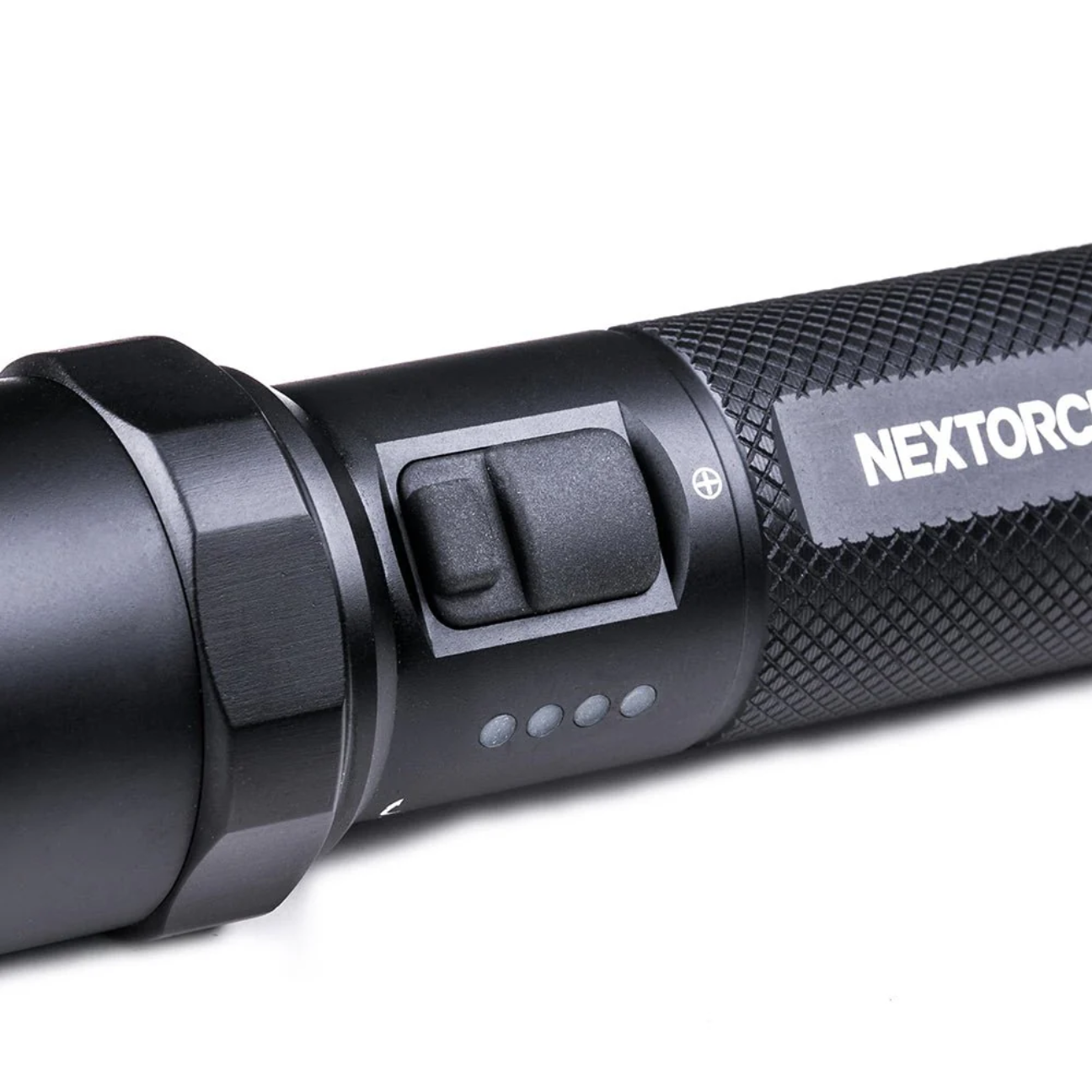 Close-up of a rechargeable tactical flashlight with textured grip and power button