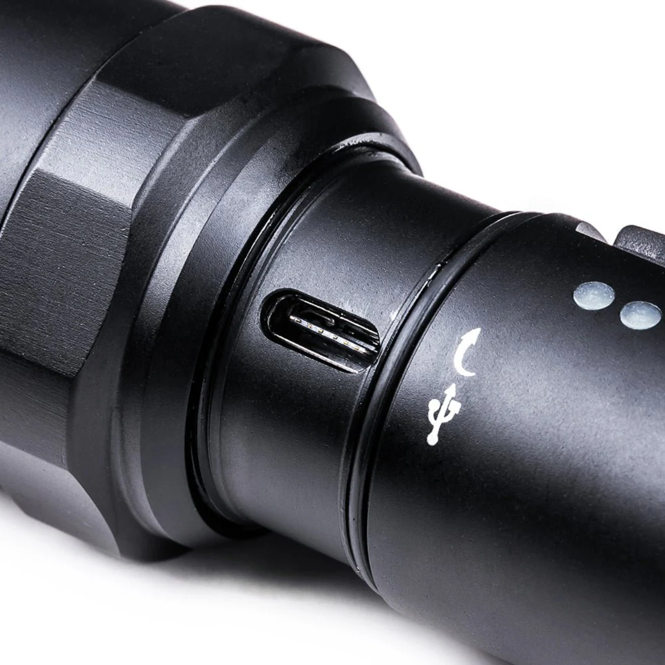 Close-up of a Rechargeable Tactical Flashlight featuring a USB charging port and durable design