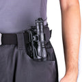 VMIDirect Tactical Flashlight Holster securely holding a flashlight in a utility belt pocket