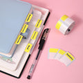 Colorful Thermal Label Stickers Patterned organized on a planner with a pen for easy indexing