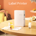 Portable VMIDirect Thermal Transfer Label Printer Maker on a wooden table with label rolls