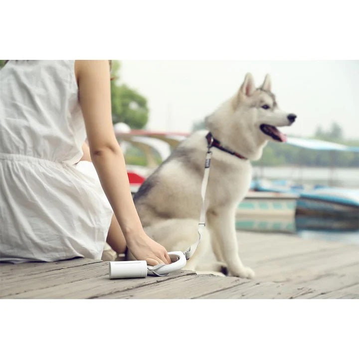 VMIDirect Dog Waste Bag Dispenser attached to a leash for easy waste disposal during walks