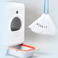 Portable Cat Litter Waste Receptacles Bag hanging beside a litter box for easy disposal