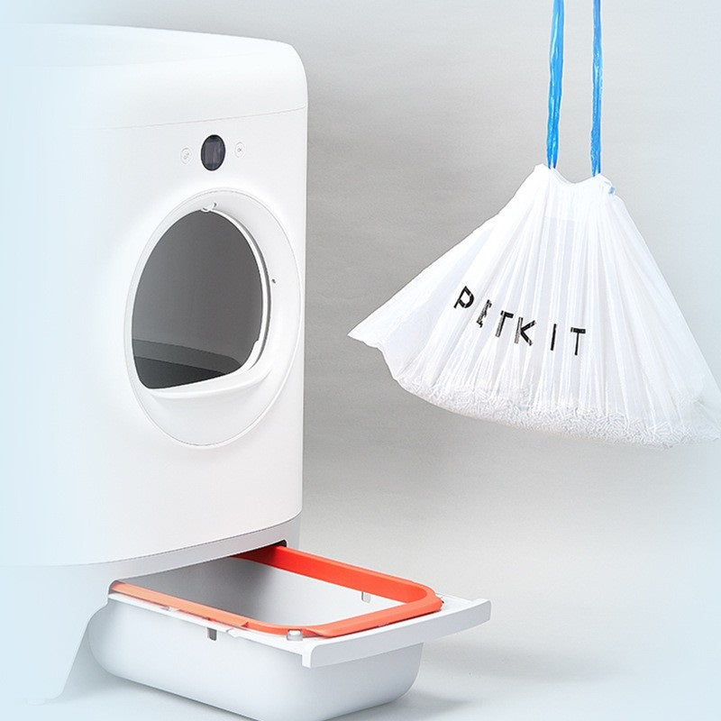 Portable Cat Litter Waste Receptacles Bag hanging beside a litter box for easy disposal
