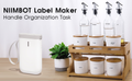 VMIDirect Portable Bluetooth Label Printer next to organized glass containers for convenient labeling