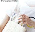 VMIDirect portable fan being held in a hand, designed for easy carrying in a bag