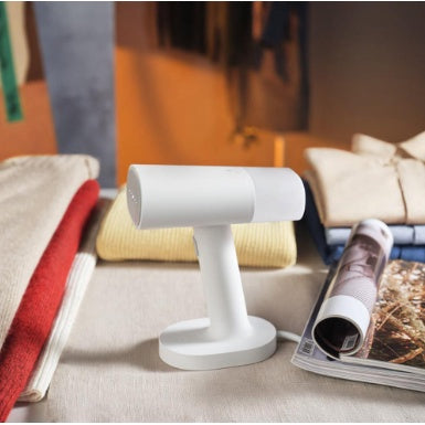 VMIDirect Portable Garment Steamer on a table, designed for quick and easy garment care
