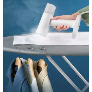 Portable Garment Steamer in use, effectively removing wrinkles from a shirt on an ironing board