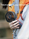 VMIDirect portable handheld fan easily fits into bags, perfect for staying cool outdoors