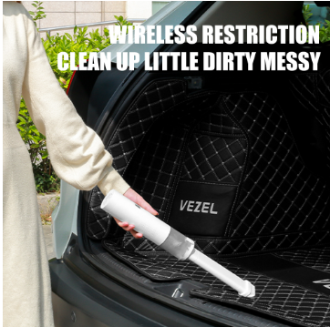 Portable Vacuum Cleaner in action, removing dirt from a car trunk with wireless convenience