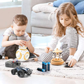 Two children playing with toys powered by AA Battery 1.5v Non-Rechargeable Alkaline Batteries on a rug