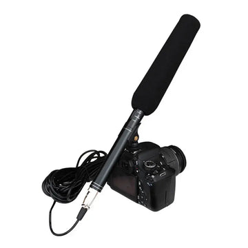 Professional handheld interview microphone with attached cable on a DSLR camera
