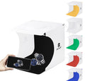 LED Photo box for product photography with multiple color backdrops and a watch displayed