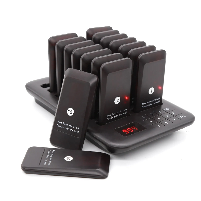 Restaurant Guest Pager System with multiple black pagers on charging base for efficient seating management