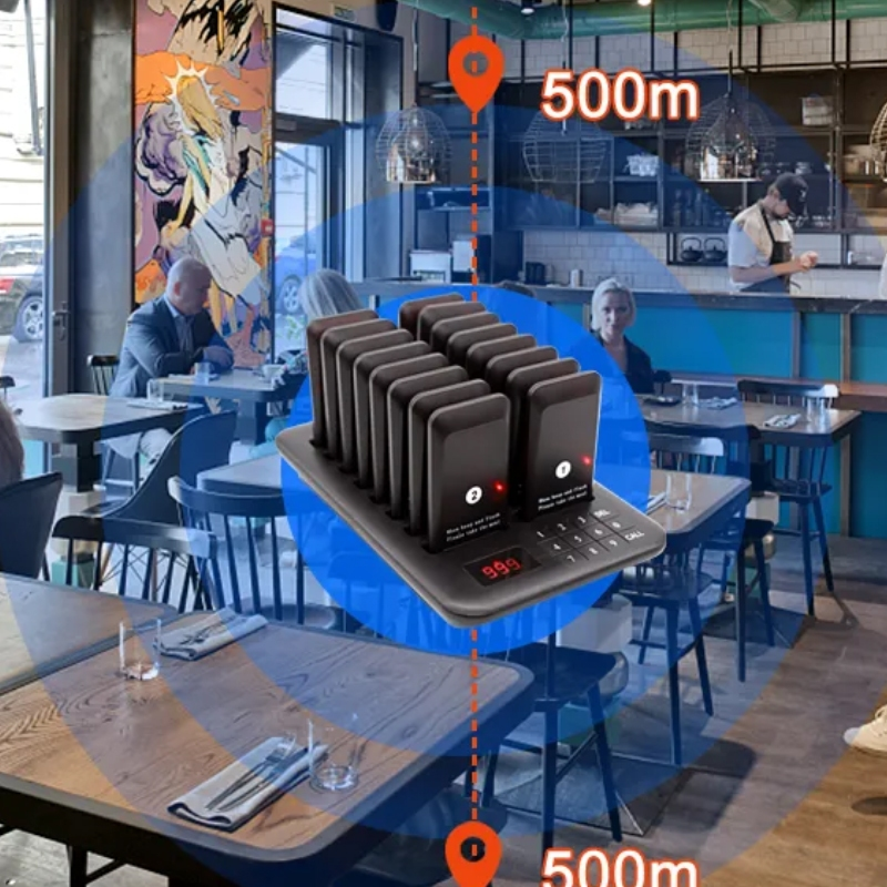 Restaurant Guest Pager System with multiple pagers on charging base in a modern restaurant setting