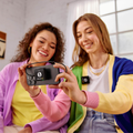 Rode Wireless ME Microphone System used by two women showcasing smartphone connectivity and clear audio features