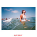 Sample shot of a woman in the ocean using Color Negative 35mm Film for vibrant images
