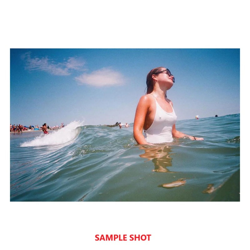 Sample shot of a woman in the ocean using Color Negative 35mm Film for vibrant images