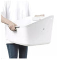 Person holding a white Self-Cleaning Cat Litter Box designed for easy use and maintenance