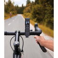 Handheld Grip Fill Light And Mounts attached to bicycle handlebars for capturing videos on the road