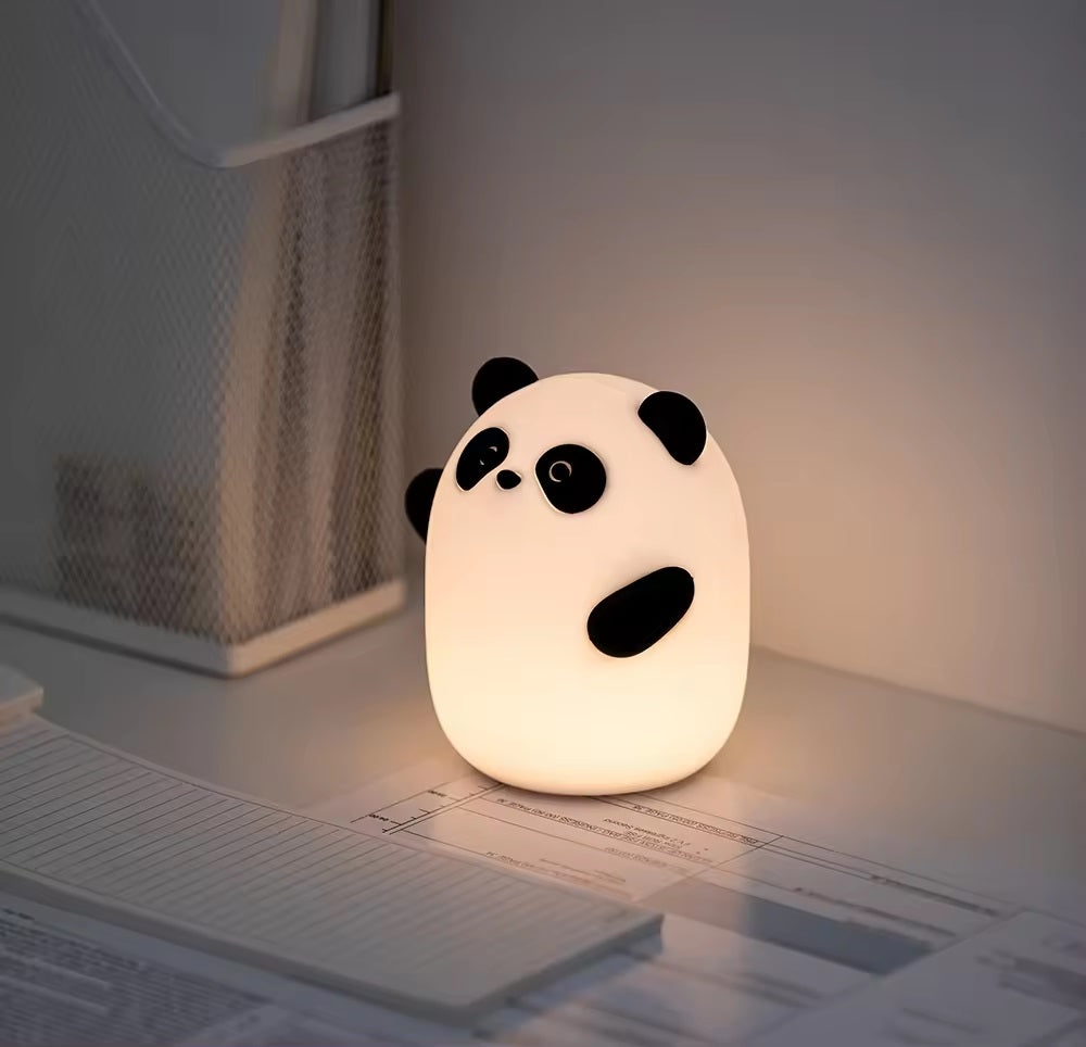 Cute panda-shaped bedroom lamp emitting soft light, perfect for children's rooms or playful decor