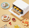 VMIDirect Smart Steam Oven baking delicious pastries with surrounding food items on a table