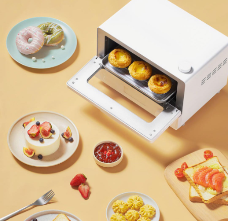 VMIDirect Smart Steam Oven baking delicious pastries with surrounding food items on a table