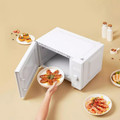 VMIDirect Smart Steam Oven with a white exterior and open door, showcasing seafood dishes on a plate