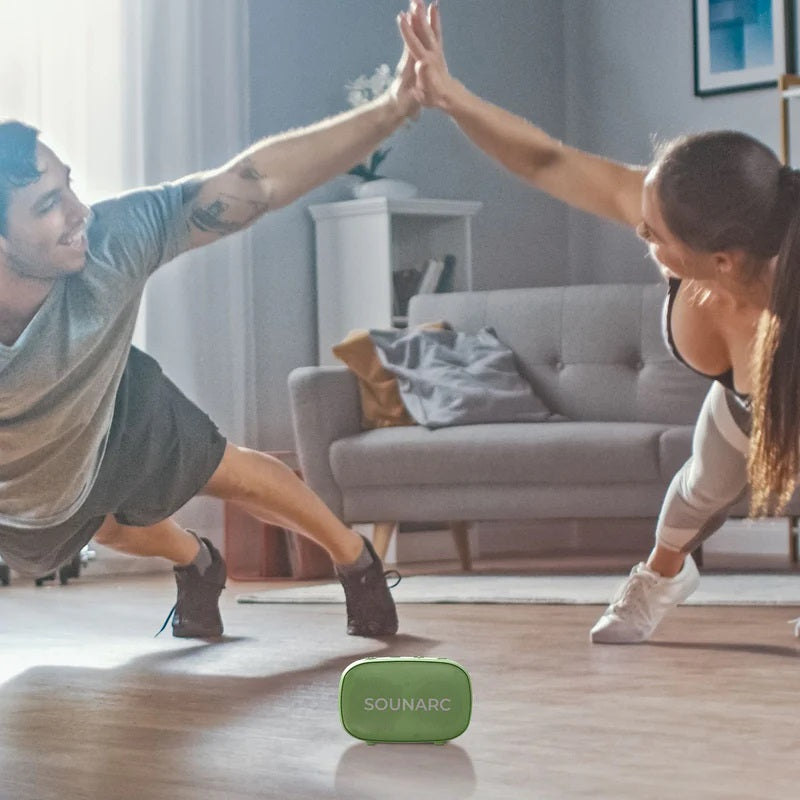 Couple exercising with VMIDirect Portable Outdoor Speaker on the floor, enhancing their workout experience