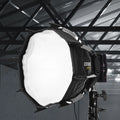 Synco COLBOR CP25 parabolic softbox attached to a light stand for soft, diffused lighting in photography