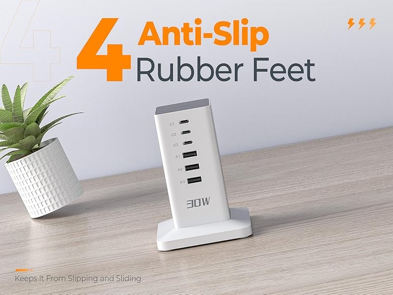 Extension cord desktop charging station for multiple devices with 4 anti-slip rubber feet on wood surface