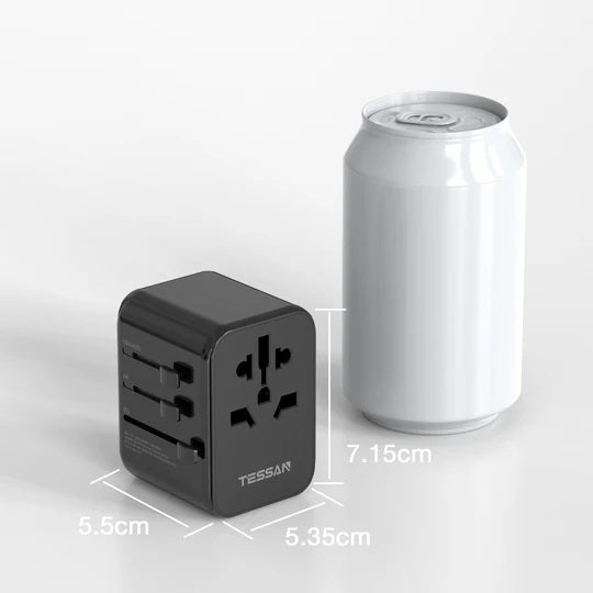 Portable universal charger for travel next to a soda can showing compact size and multiple plug outlets