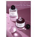 Transparent Acrylic Geometric Photo Props with Night Repair Serum bottles on a pink background