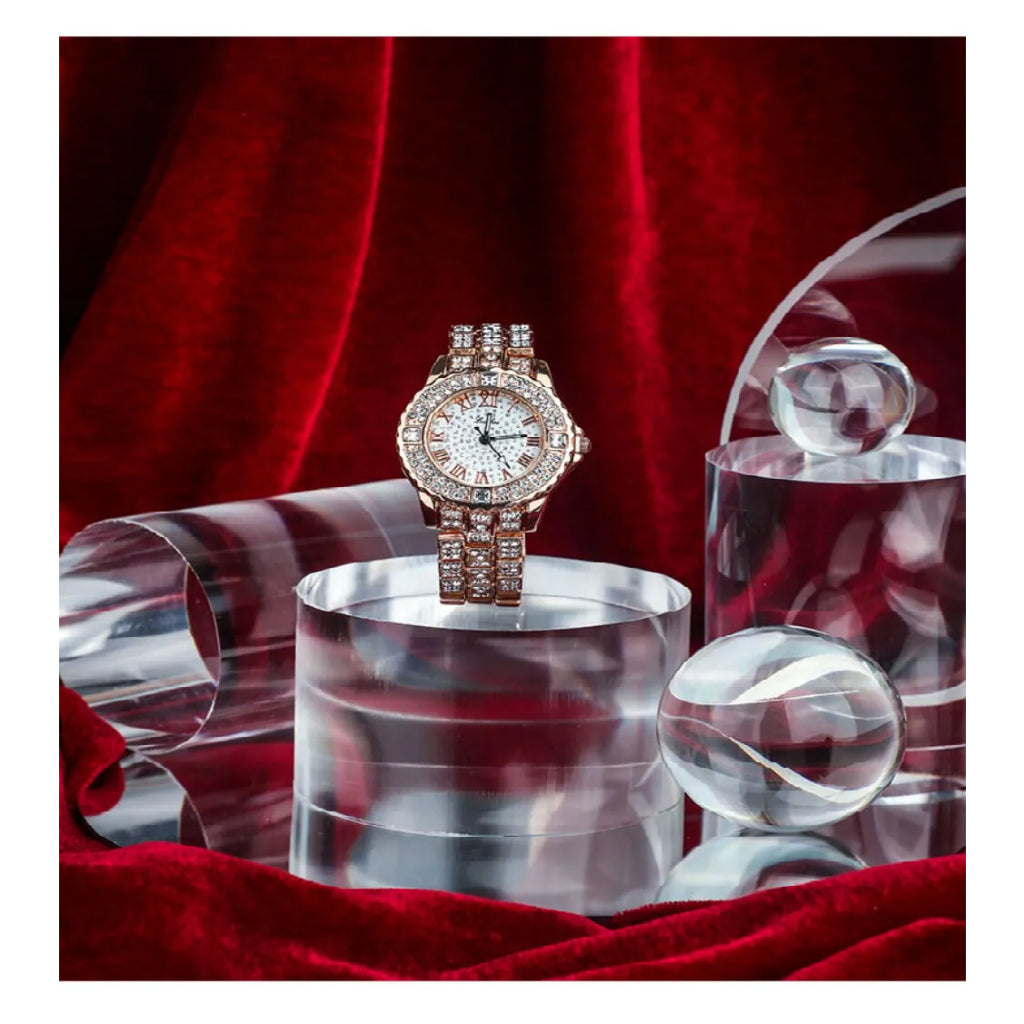 Transparent Acrylic Geometric Photo Props with a luxury watch and decorative glass orbs on red fabric