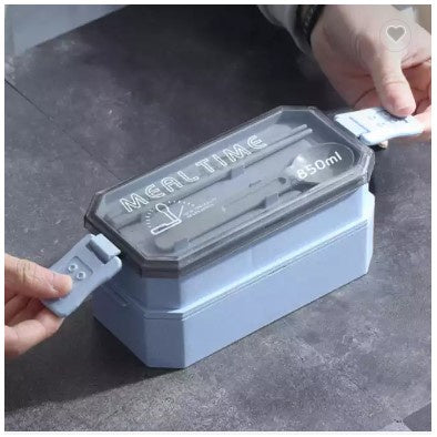 Hands holding a 2-Layer Portable Plastic Bento Lunch Box with a transparent lid and secure clips