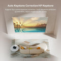 Auto focus home cinema projector displaying a sunset scene with auto keystone correction in a living room