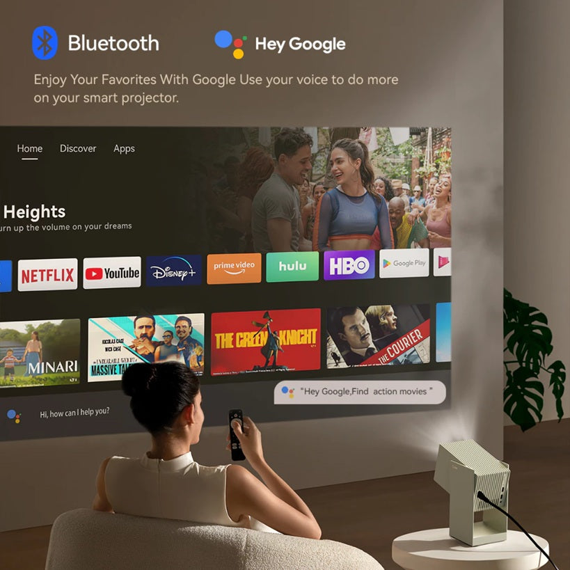 Woman using Wanbo Cube 2 Pro 1080P smart projector to stream shows with Bluetooth and Google Assistant