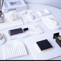 Wave Plaster Cutting Board Decoration set on a stylish table with various accessories and products