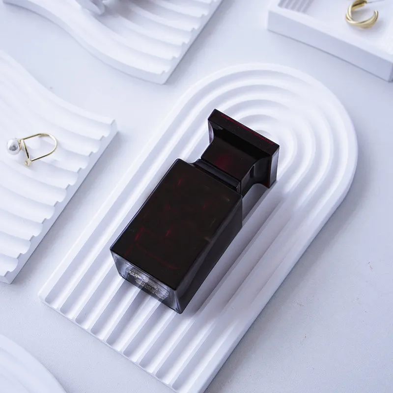 Wave Plaster Cutting Board Decoration featuring stylish grooves and a minimalist design with fragrance bottle
