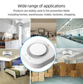 Wireless smoke detector shown in various applications including home kitchen bedroom warehouse and industrial settings