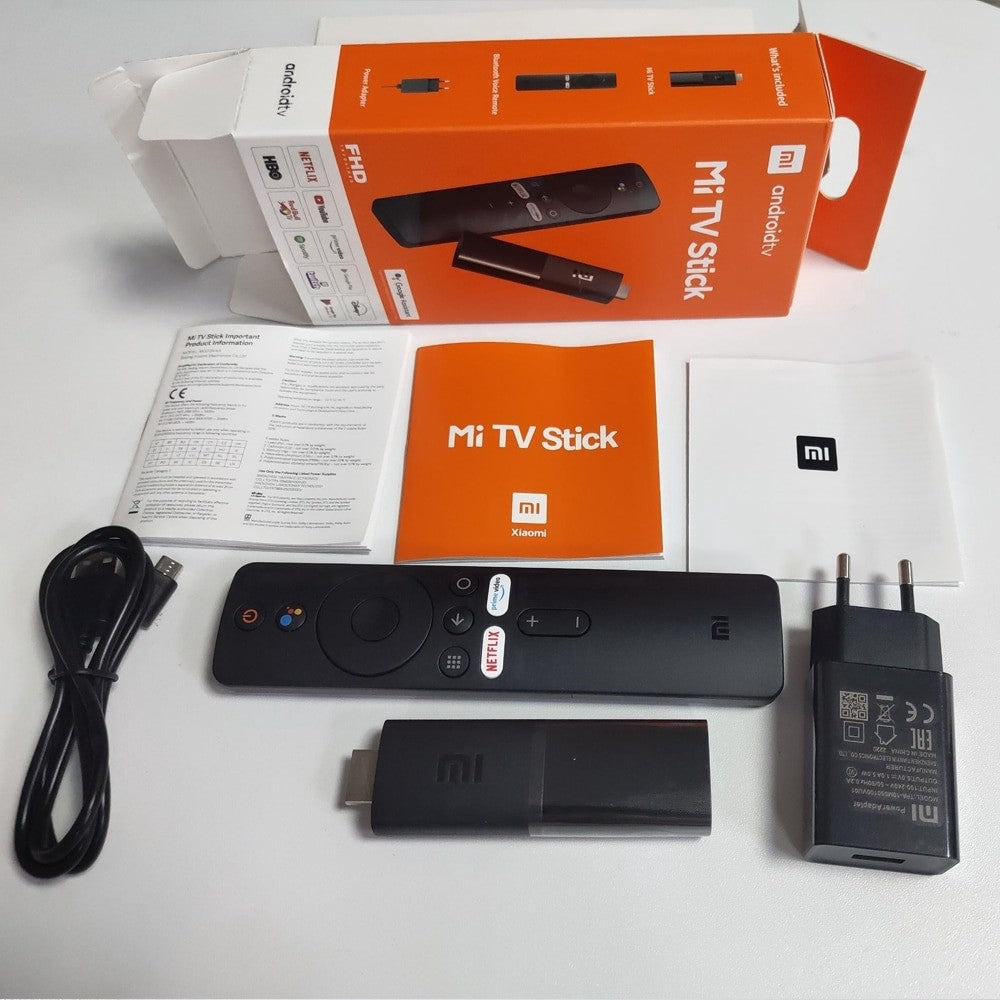 Xiaomi TV Stick package with remote, USB cable, and power adapter for streaming content