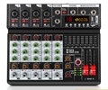 Audio mixer with DSP effects featuring USB inputs and multiple control knobs for professional sound mixing
