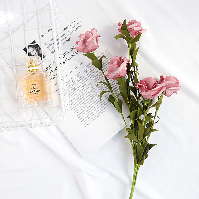 Artificial Flowers Silk Pink Roses Arrangement Next to Perfume Bottle and Magazine for Home Decor