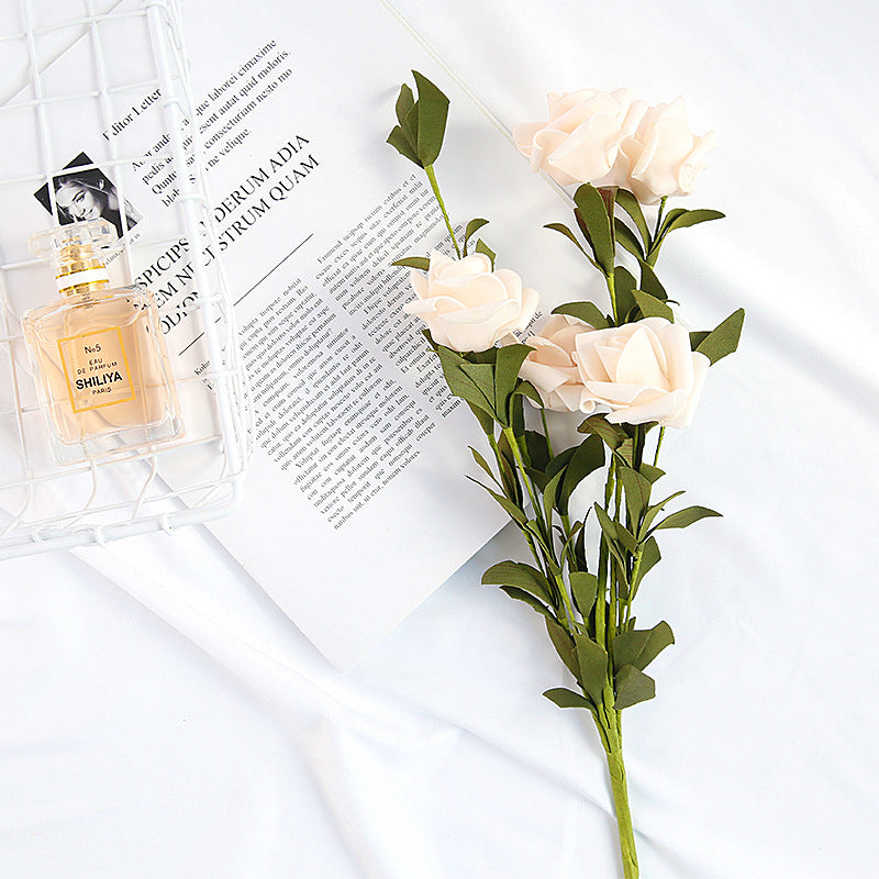 Artificial Flowers Silk Peony Bouquet arranged next to a perfume bottle on a white surface