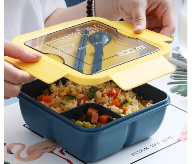 1100ml Plastic Bento Lunch Box in blue with a yellow lid and delicious vegetable rice inside