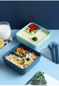 1100ml Plastic Bento Lunch Box with divided sections for rice, vegetables, and yogurt