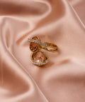 Cloth Photography Decoration Props with elegant gold rings featuring heart-shaped stones on soft satin fabric