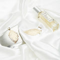Elegant Cloth Photography Decoration Props featuring a perfume bottle and leaf-shaped jewelry on satin fabric